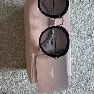 Miu Miu Black Cat-Eye Sunglasses with Glossy Finish MIUMIUEYEWEARBlackCat-  main image 4